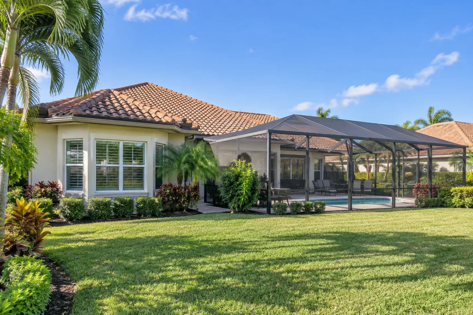 A single-family Cooper City home with a screened pool enclosure