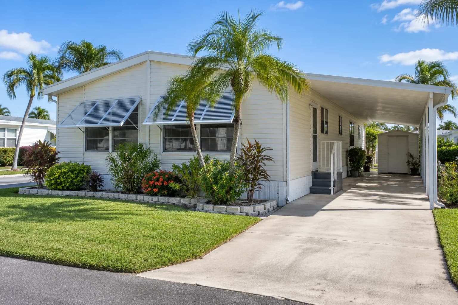 A well-kept manufactured home in Pembroke Park with clean windows