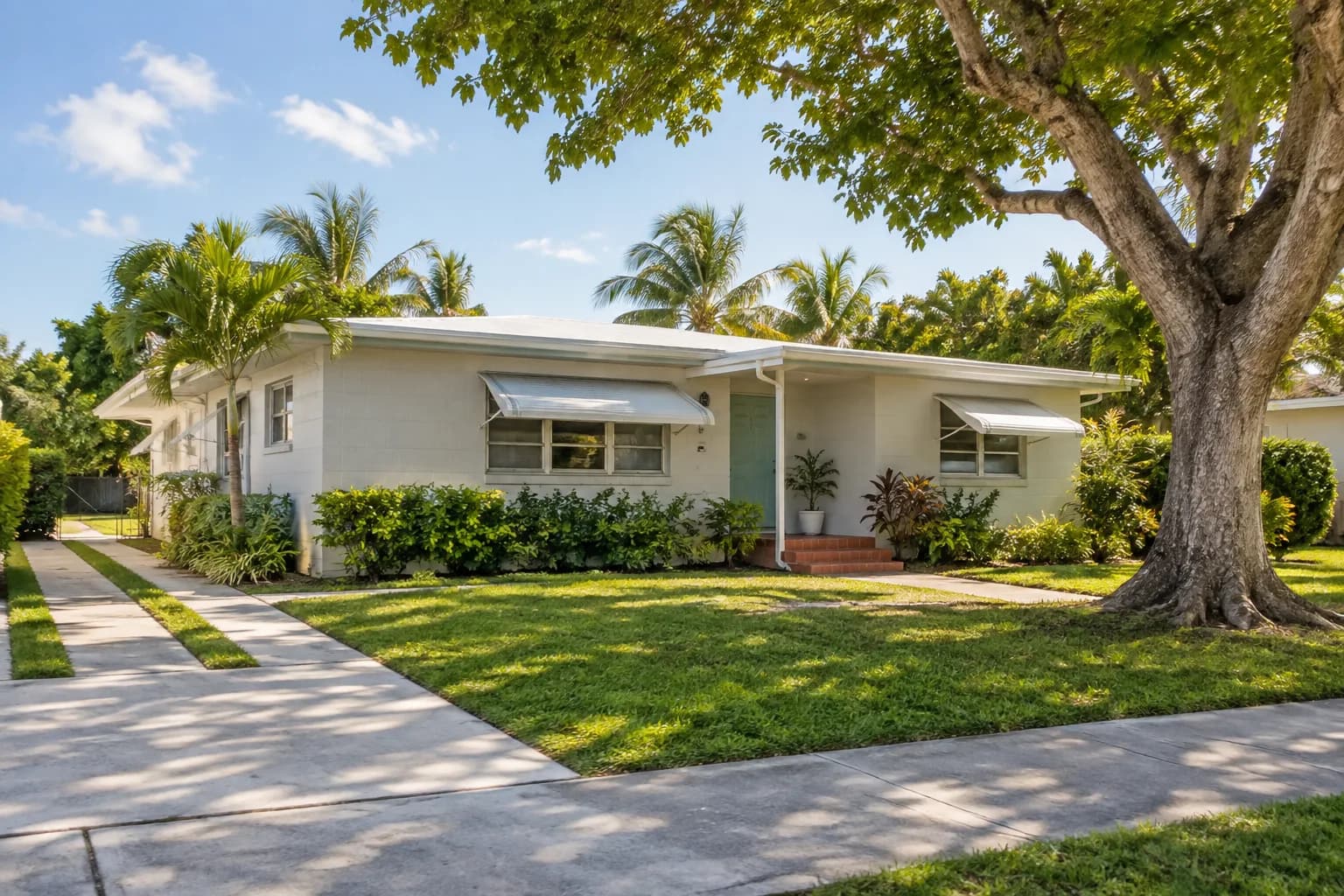 A 1950s concrete-block home in West Miami with awning windows